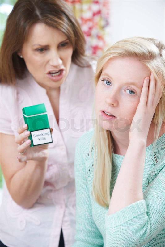 Mother Confronting Daughter Over Dangers Of Smoking, stock photo