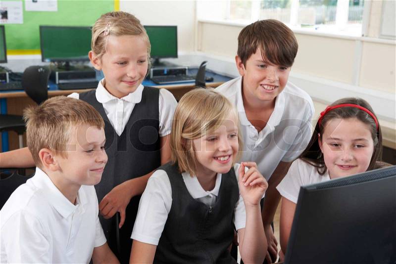 Group Of Elementary School Pupils In Computer Class, stock photo