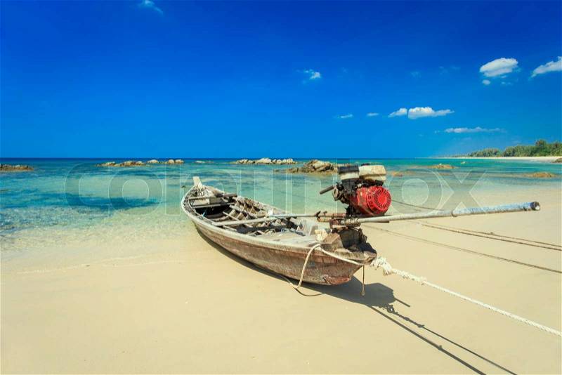 Traditional Thai Long tail boat on the beach in Thailand, stock photo