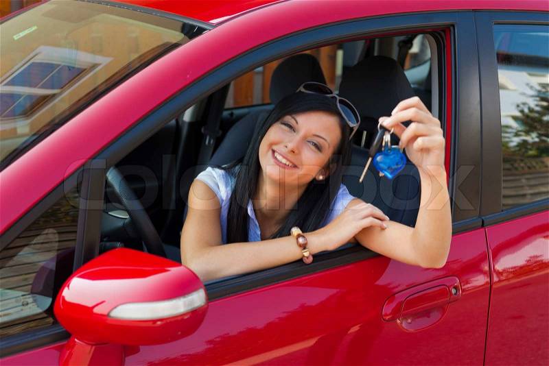Young woman with new car and car keys, stock photo