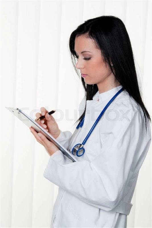 Physician diagnosis in the hospital and patient record, stock photo