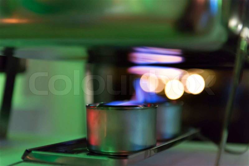 Alcohol stove with a hot plate of a catering, stock photo
