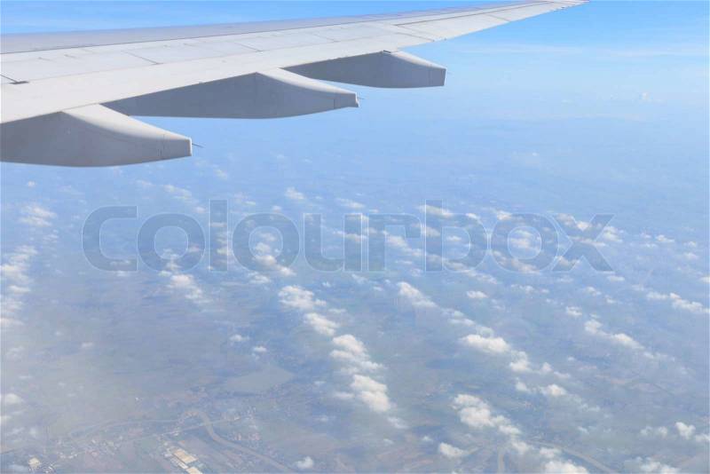 Airplane wing view from window beautiful sky, stock photo