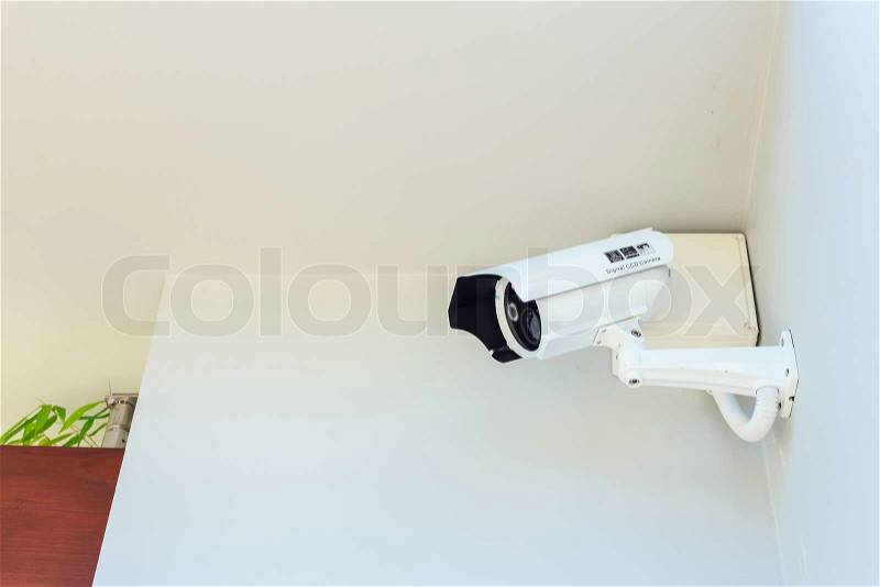 CCTV camera in front of house, stock photo