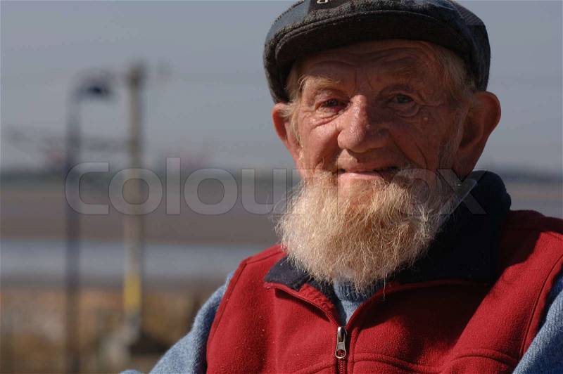Bearded Old Man Happily Posing for the Camera, stock photo
