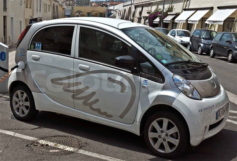 NICE, FRANCE - JUNE 6, 2014: Smart electric drive cars charging at on-street stations. , stock photo