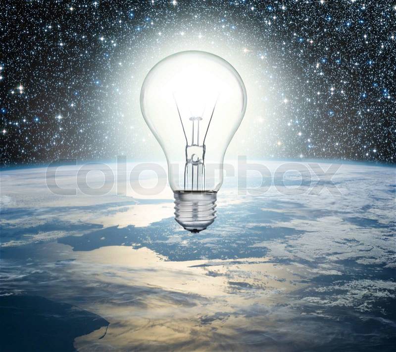 Light bulb over Earth on a background of the universe, stock photo