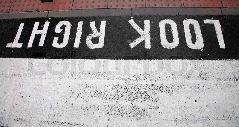 Traffic signs in a city painted on asphalt, stock photo