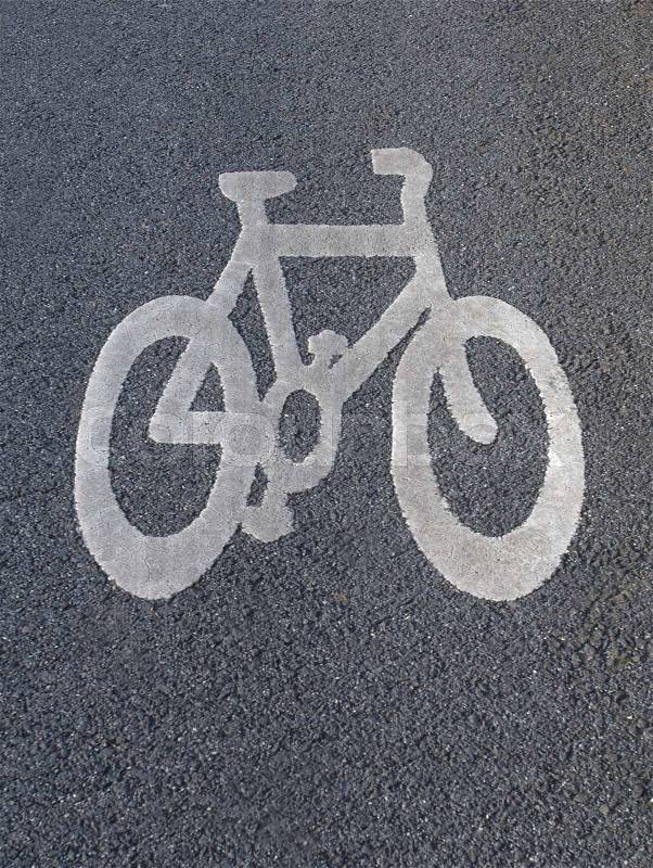Shape of a bicycle carved on road, stock photo