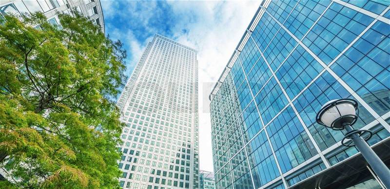 Canary Wharf skyline, office buildings, street view - London, stock photo
