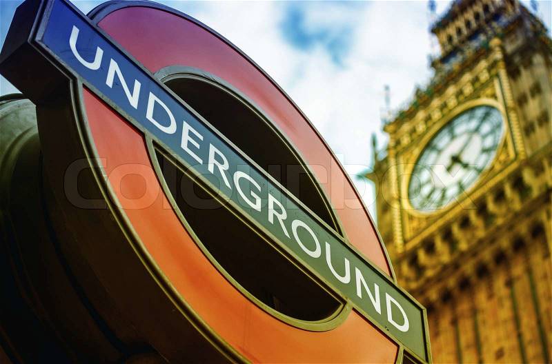 LONDON, UK - SEPTEMBER 27, 2013: Symbols of London - Underground sign and Big Ben clock tower, stock photo