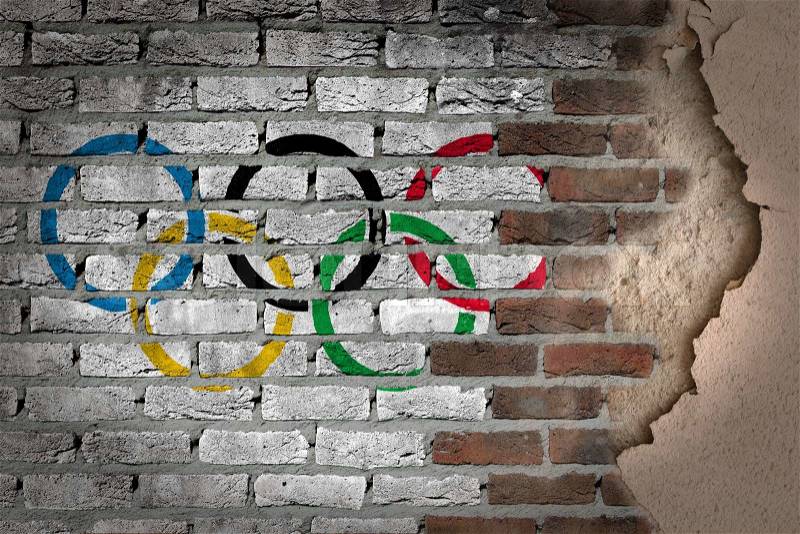 Dark brick wall texture with plaster - flag painted on wall - Olympic rings, stock photo