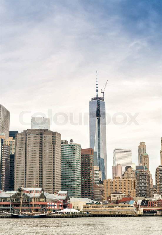Lower Manhattan skyline over East River, New York City, stock photo