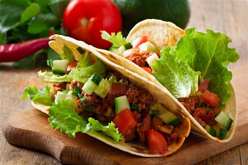 Mexican tacos with meat, vegetables and cheese, stock photo