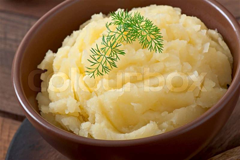 Fresh and flavorful mashed potatoes with bowl, stock photo