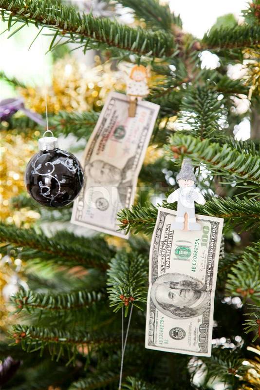 Christmas tree with hanging money (US dollar) decoration Stock Photo Colourbox
