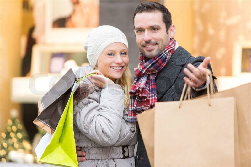View of a Young attractive couple with shopping bags, stock photo