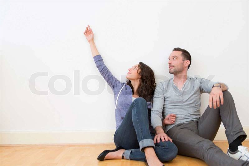 View of a Young couple in their brand new flat / Textspace, stock photo