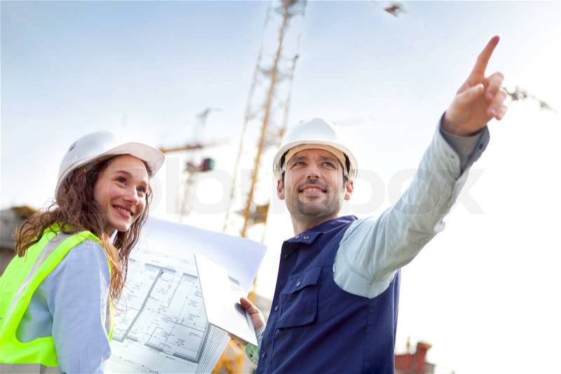 View of Co-workers working on a construction site, stock photo