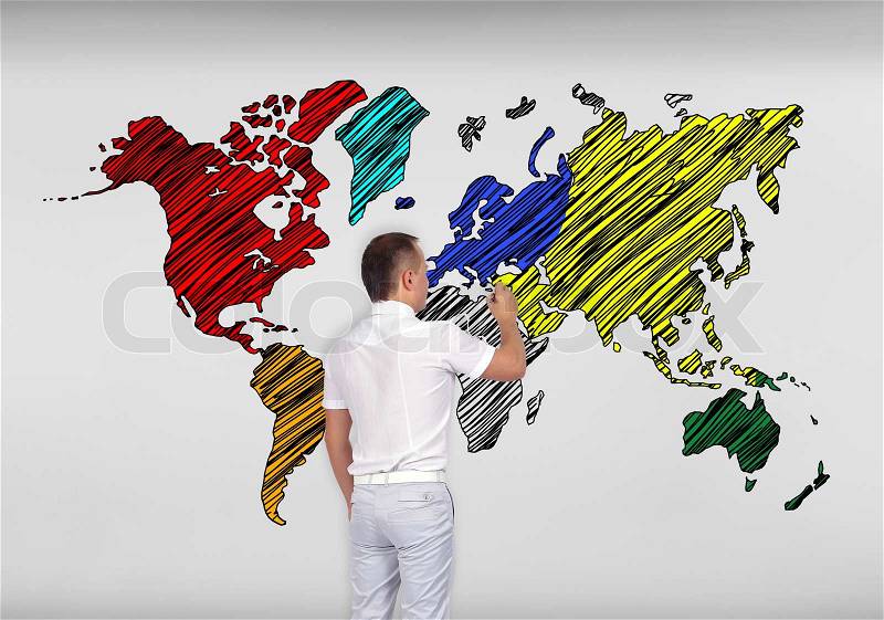 Businessman drawing world map on concrete wall, stock photo