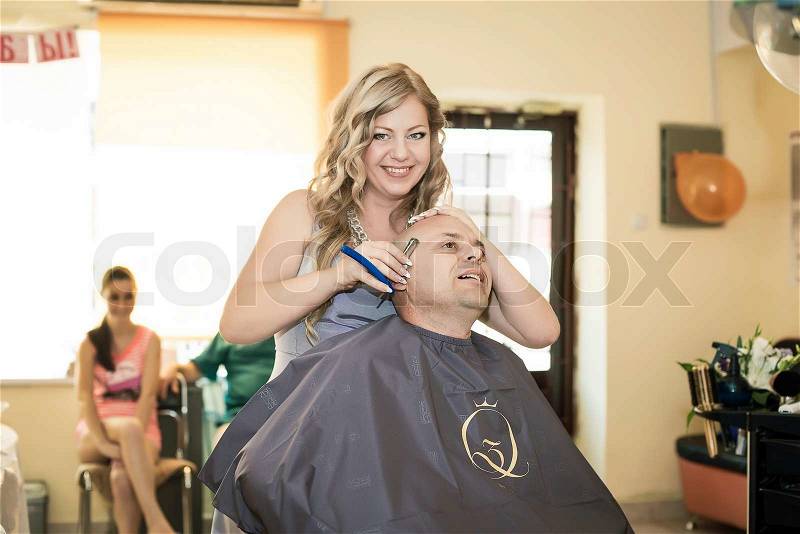Woman cutting hair man. beauty salon, stock photo