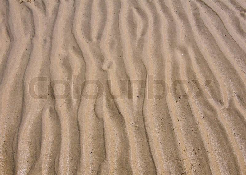Wave line pattern in beach sand, stock photo