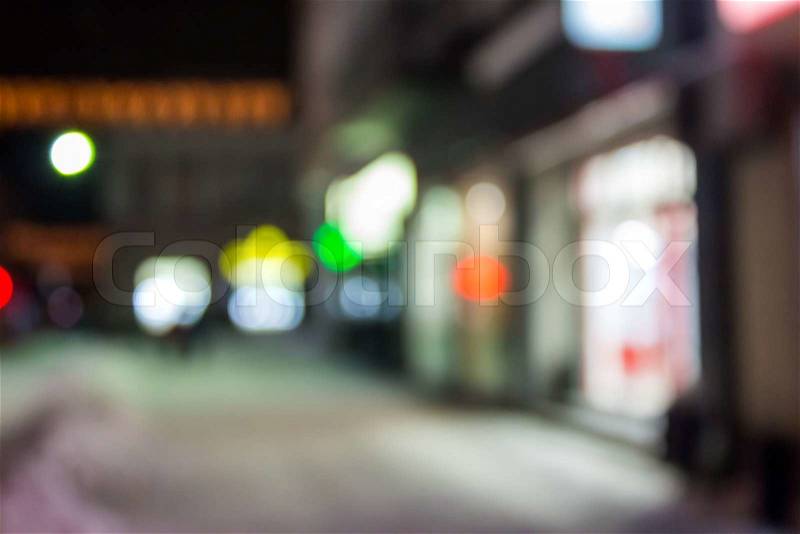 Abstract empty witer city street background of blurred warm lights with hot red spot with bokeh effect, stock photo