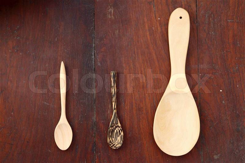Wood spoons on wood background, stock photo