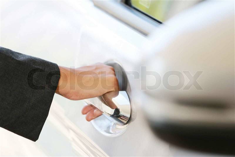Hand business woman open car door. close up, stock photo
