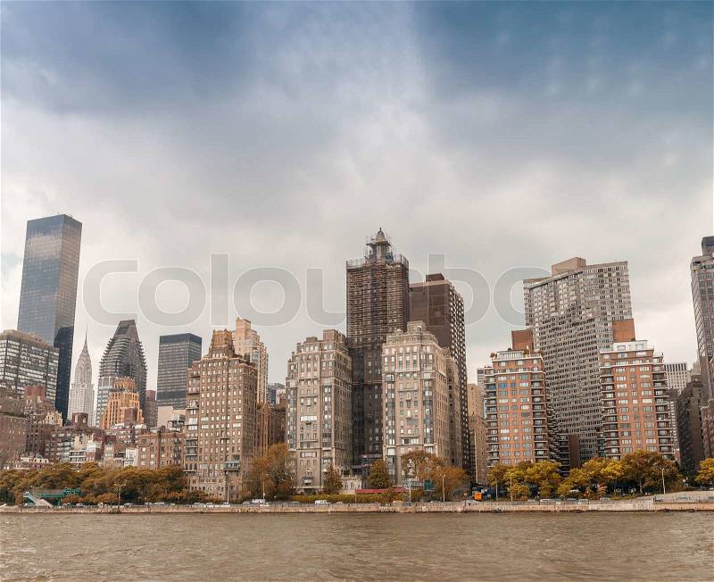 Midtown Manhattan skyline from East River - New York City, stock photo