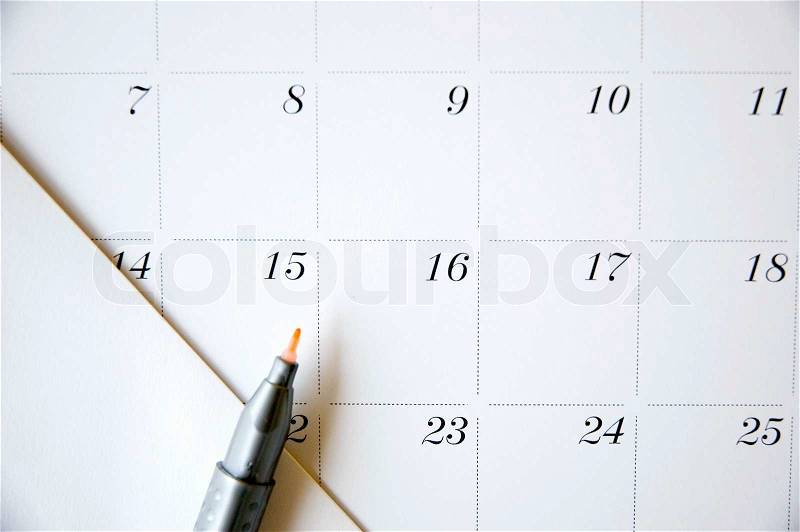 Close up color pen point to date fifteen on calendar, stock photo
