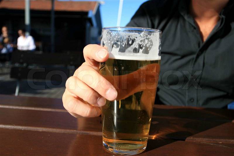 Man drinking a pint of beer, stock photo