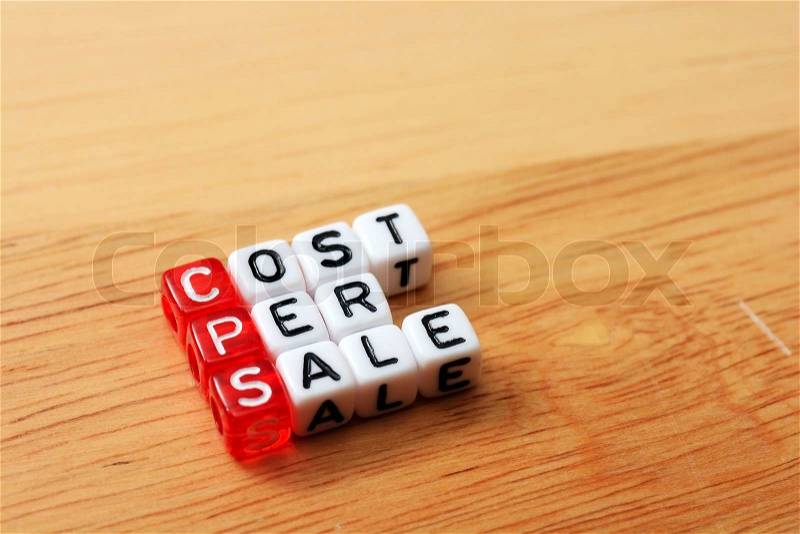 Dice with word CPS cost per sale on wooden background , stock photo