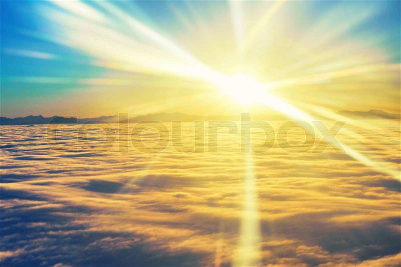 Amazing view from plane on the sky, sunset sun and clouds, stock photo