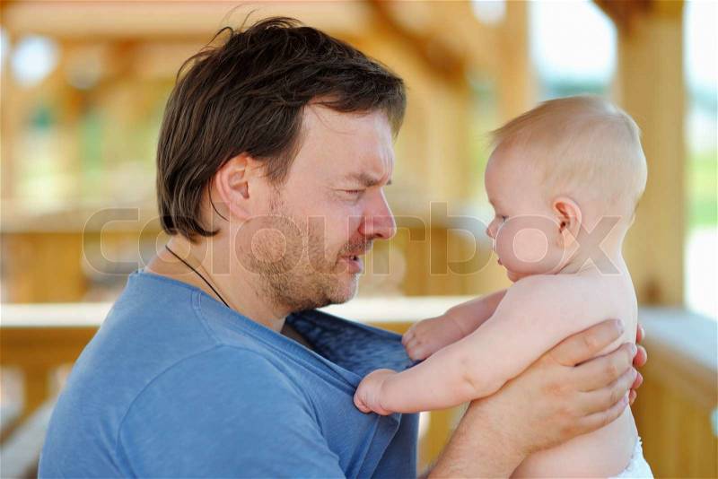 Portrait of middle age father with his little son , stock photo