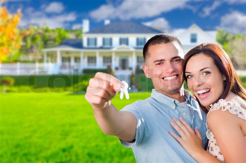 Mixed Race Excited Military Couple In Front of New Home Showing Off Their House Keys, stock photo