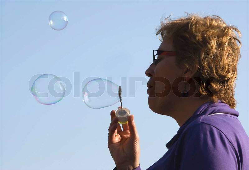 Blowing woman, stock photo