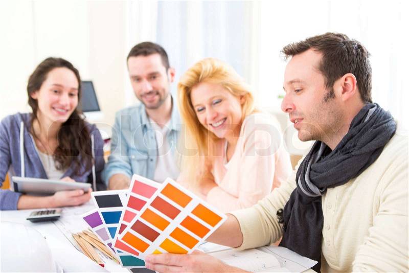 View of Architect students choosing colors for their project, stock photo
