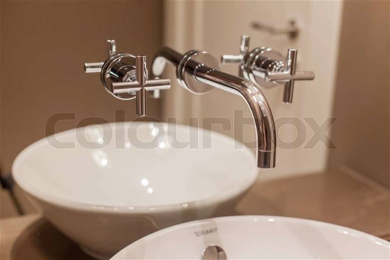 Side view of Faucet and marble sink in the luxury hotel, stock photo