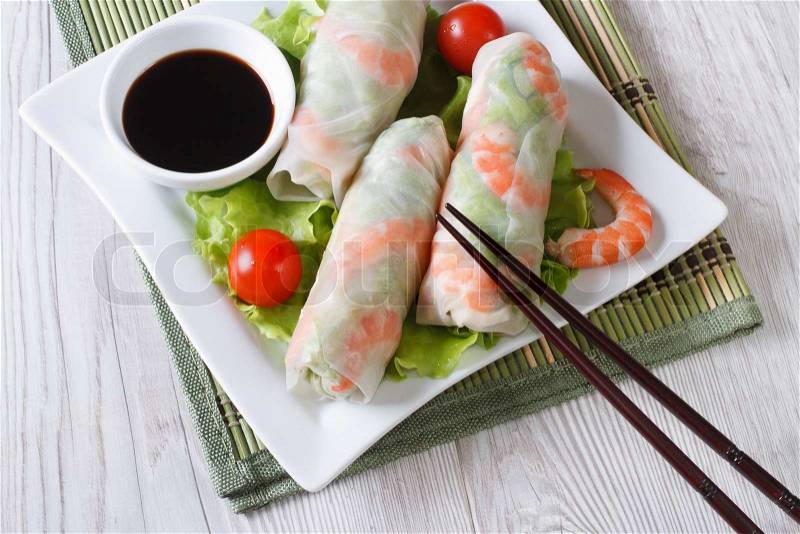 Korean spring rolls with shrimp and sauce on a plate close-up. horizontal , stock photo