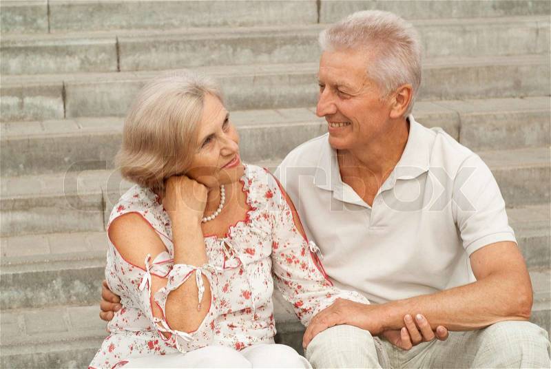 Nice elderly couple went for a walk around the city together, stock photo