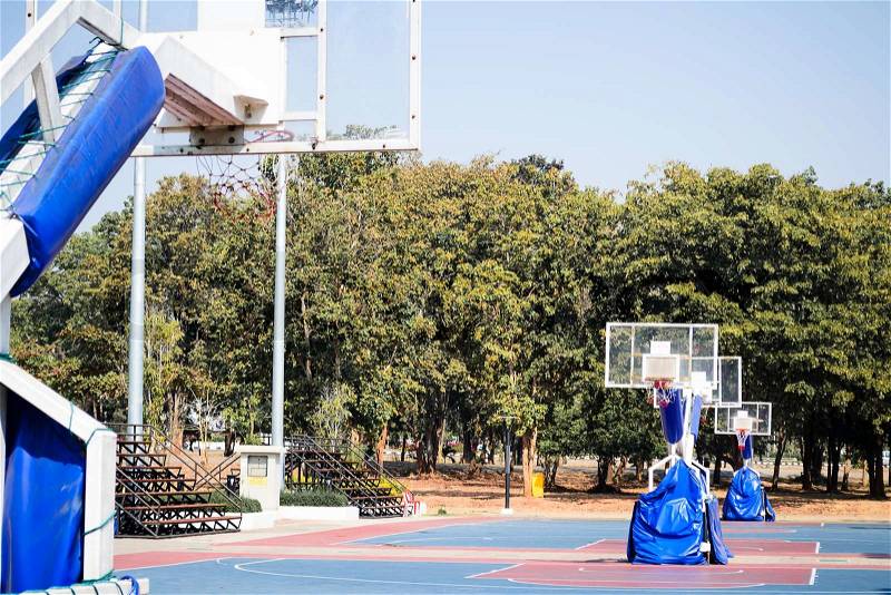 Outdoor basketball Stadium and sport light with blue sky, stock photo