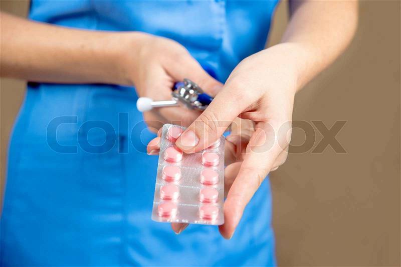 Doctor with pills in hand. many pills, stock photo