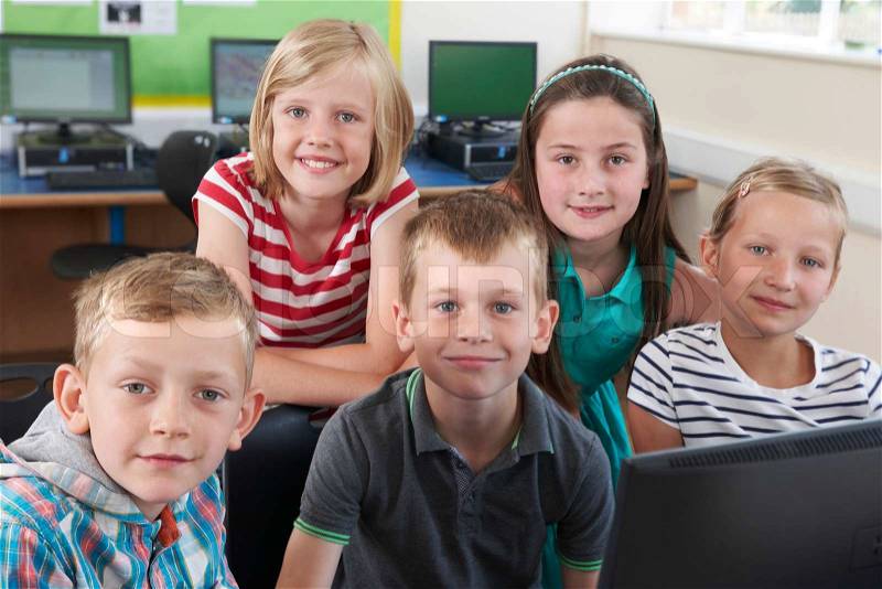 Group Of Elementary Pupils In Computer Class, stock photo
