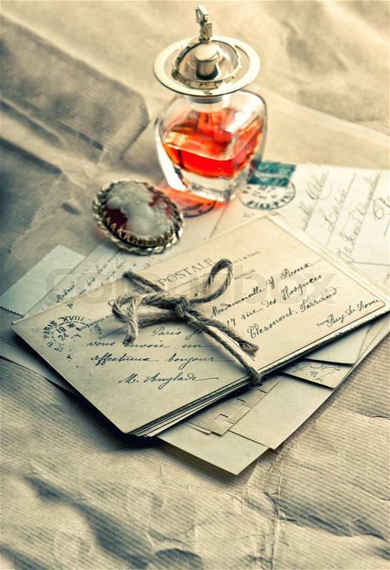 Old love letters, antique accessories, perfume and cameo. sentimental nostalgic background. vintage style toned picture, stock photo