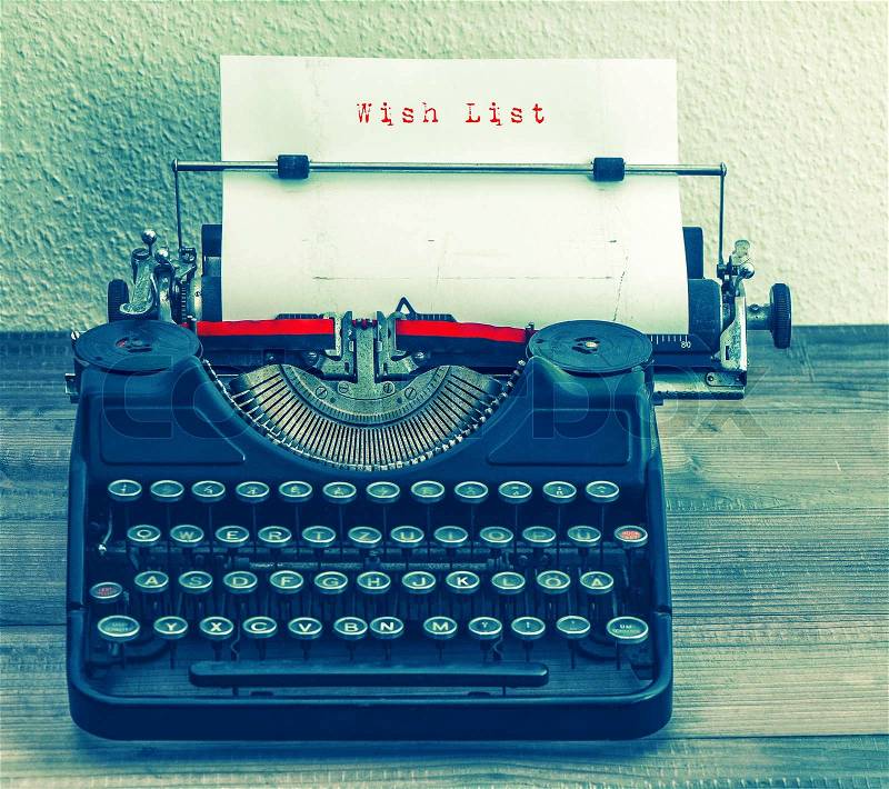 Old typewriter with sample text Wish List. Retro style toned picture, stock photo