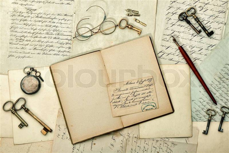 Open book, vintage accessories, old letters and postcards. nostalgic aged paper background. retro style toned picture, stock photo