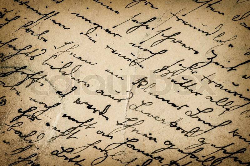 Vintage handwriting. antique script. grunge paper background with dark vignette, stock photo