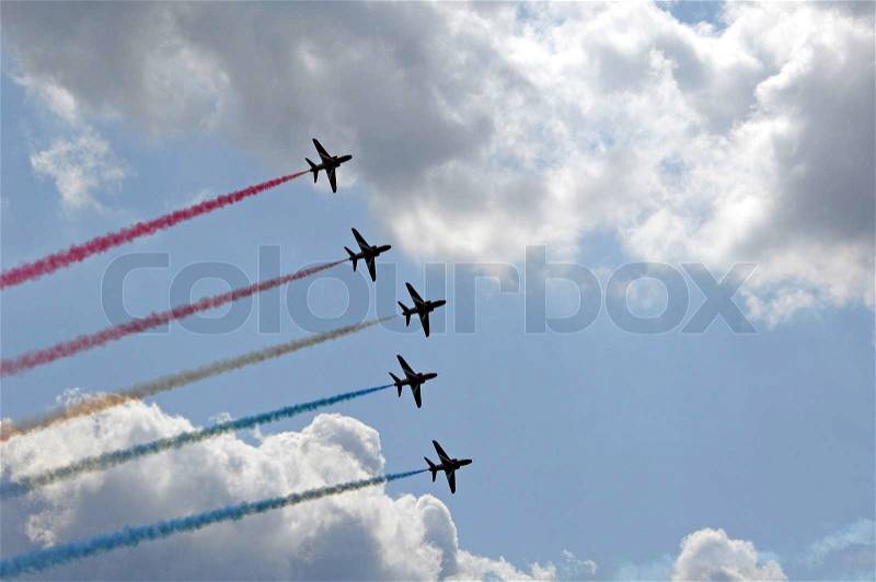 Low angle view of fighter planes flying in formation at an aerobatic display, stock photo