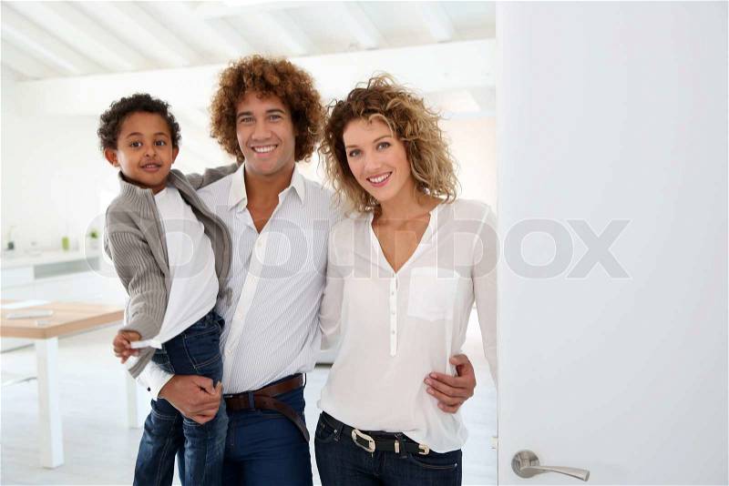 Happy family welcoming people in new home, stock photo